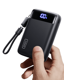 INIU Carry P51-E2 Power Bank in hand, showing 100% charge display, black portable charger